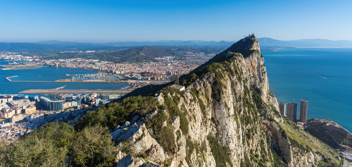 Gibraltar Rock steep cliff by the Mediterranean Sea in southern part of Iberian Peninsula.